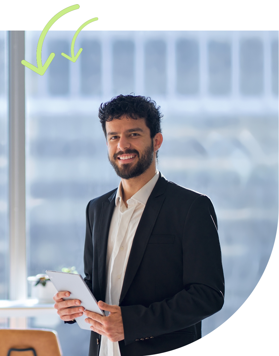 Man standing and holding a tablet